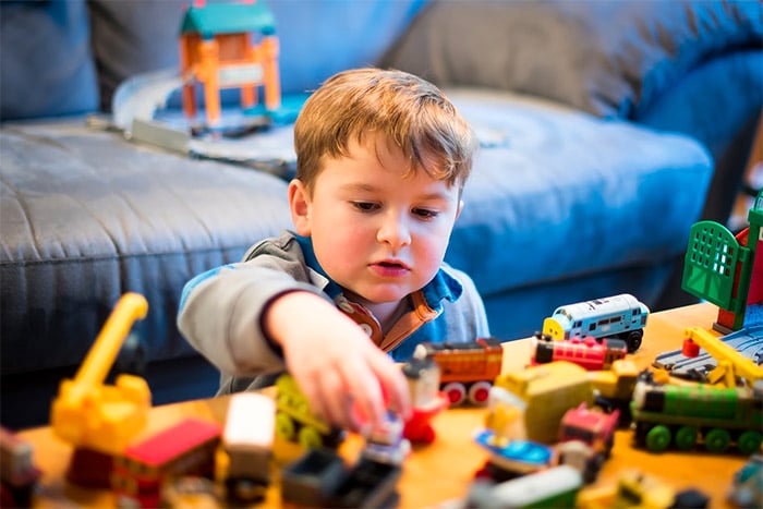 kid playing with toys